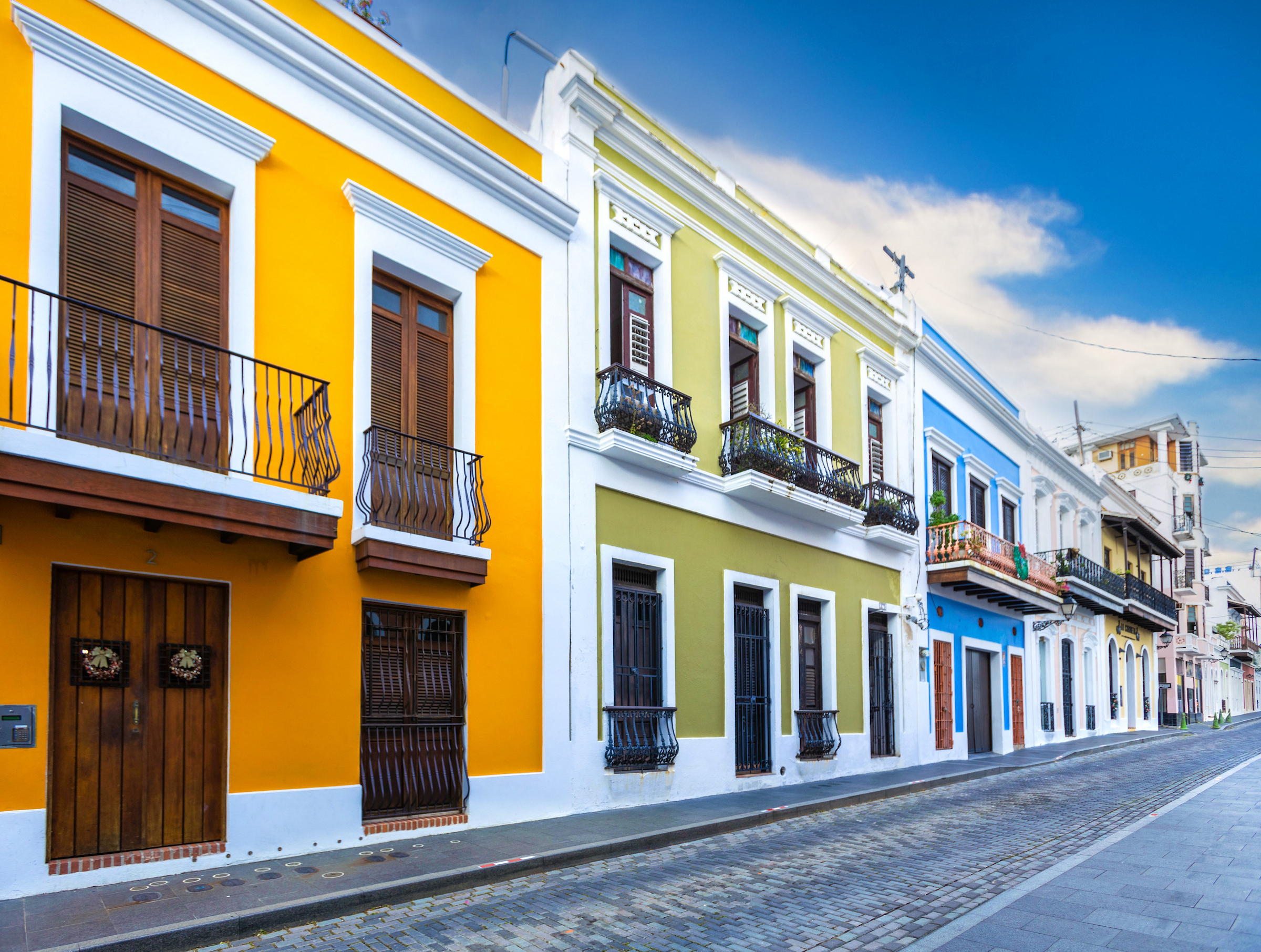 Colorful balconies on a cobblestone street in Old San Juan